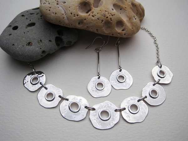 Silver necklace and earrings with saw pierced centre and soldered wire detail