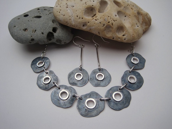 Oxidised silver necklace and earrings with saw pierced centre and soldered wire detail